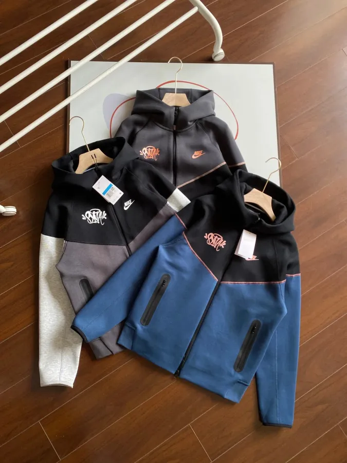 Warehouse photo of hoodies on a rack, no ruler